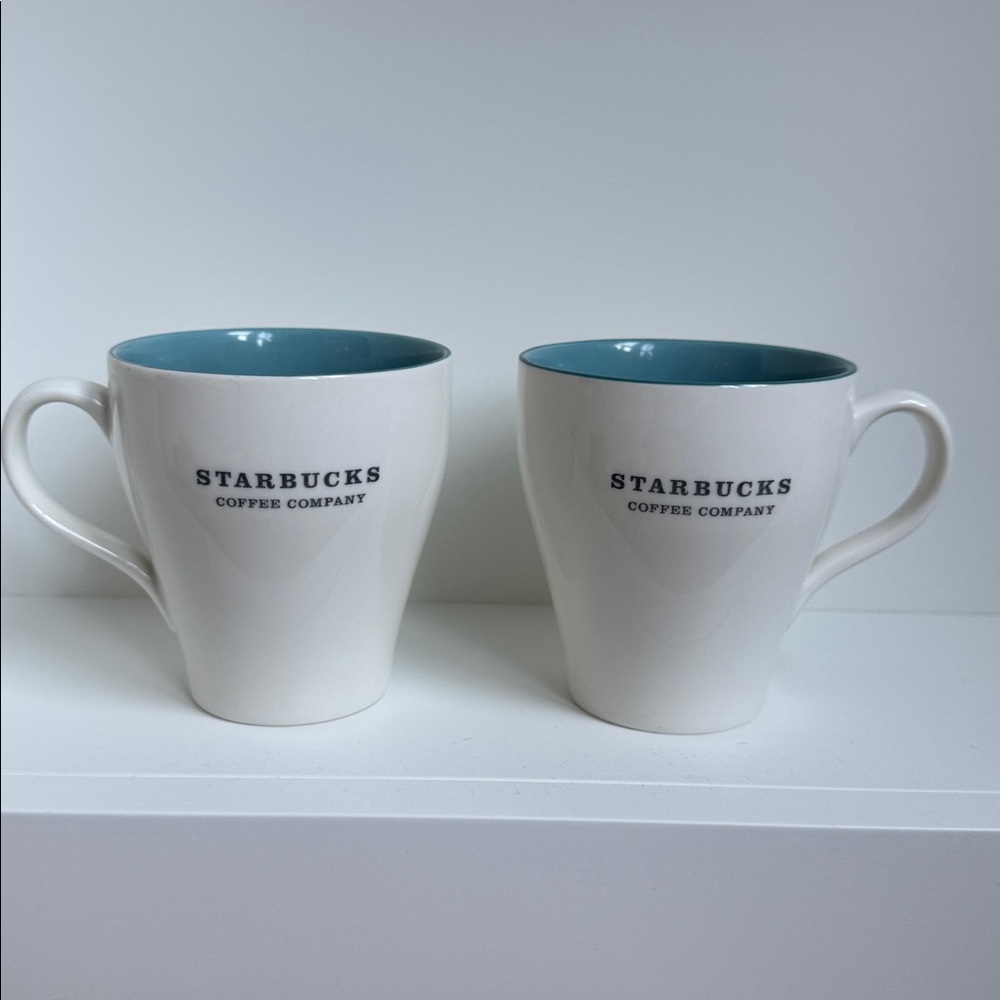 Set of two cream/blue Starbucks coffee cups